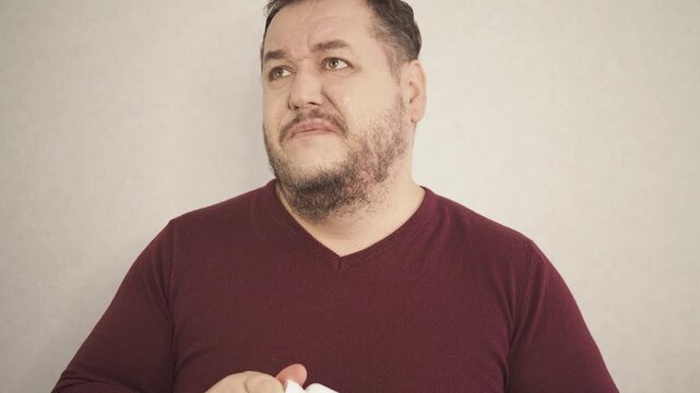 A man swears and argues with his interlocutor.