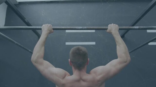 Man starting from contracted top and lowering slowly on pull-up bar for fitness strength training