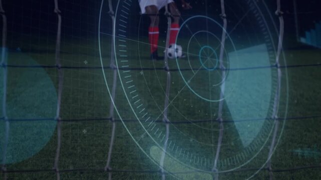 Striker striking to score through goal net, goalkeeper diving, sports HUD showing trajectory
