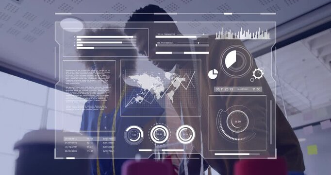 Leaning pair in checked blazer and blue-top lanyard reviewing animated dashboard in meeting room