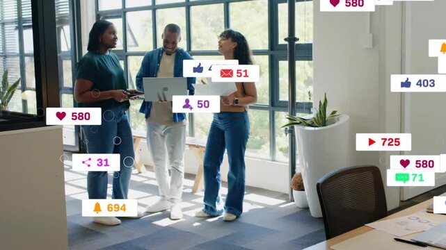 Team talking by window left tapping device making rising icons hiding team fading for marketing