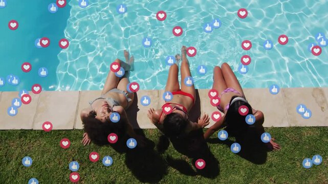 Reclining three adult women wearing blue red purple bikinis by home pool, collecting reaction icons
