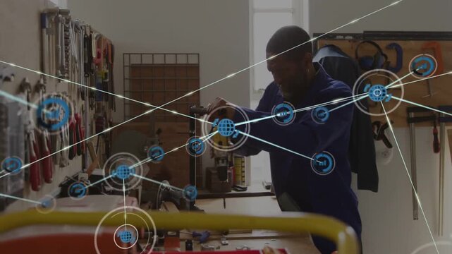 Workshop man reaching clamped part and starting drill, assembling bracket while HUD nodes expanding