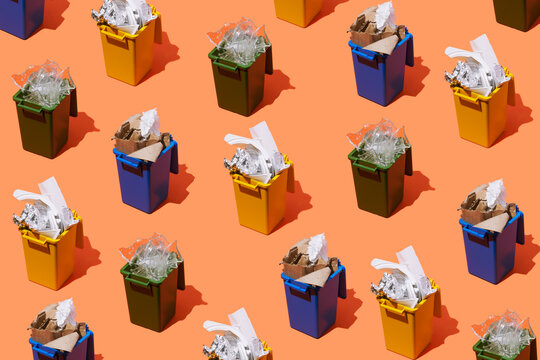 Color coded recycling bins with paper plastic and glass waste separation