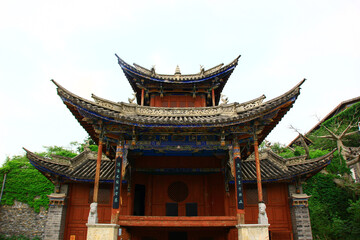 Fototapeta premium Traditional Chinese Temple with Ornate Blue-Tiled Curved Roofs