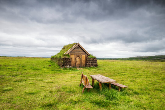 Viking-era turf church Geirssta�akirkja in Iceland under dramatic sky