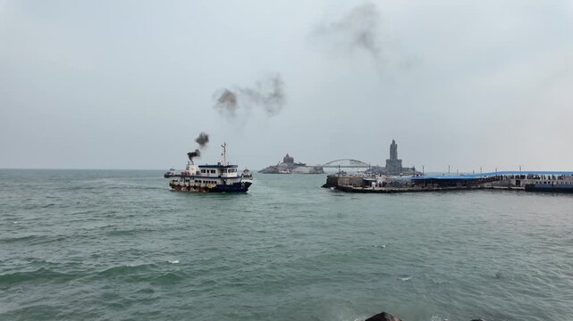 Boat Near Vivekananda Rock Memorial and Thiruvalluvar Statue at Kanyakumari Coast, India