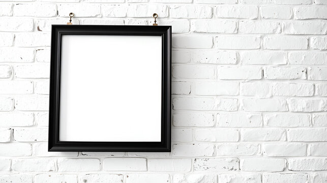 Black frame hanging on white brick wall with inscription quoin