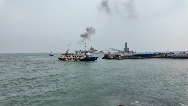 Passenger Ferry Departing Kanyakumari Coast with Vivekananda Rock Memorial and Thiruvalluvar Statue, Tamilnadu India &ndash; 4K