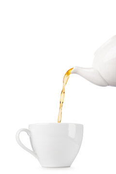 White cup of tea with teapot filling, isolated on white background.