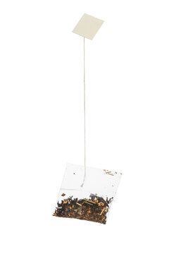 Filter tea bag with blank label, isolated on transparent background. PNG image.