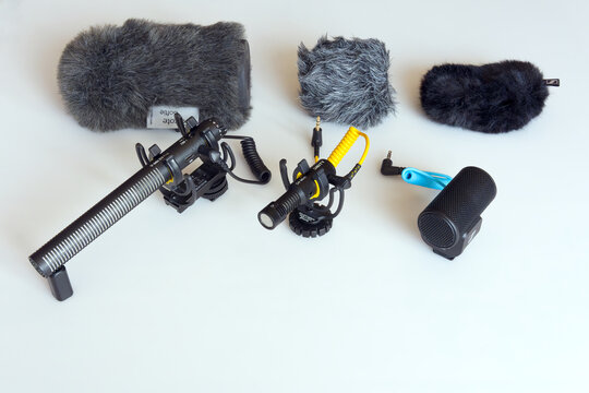 High angle view of video camera microphones Deity V-Mic D3 pro, Deity V-Mic D4 Mini and Sennheiser MKE 200 with windshields against white background. Photo taken March 19th, 2026, Zurich, Switzerland.