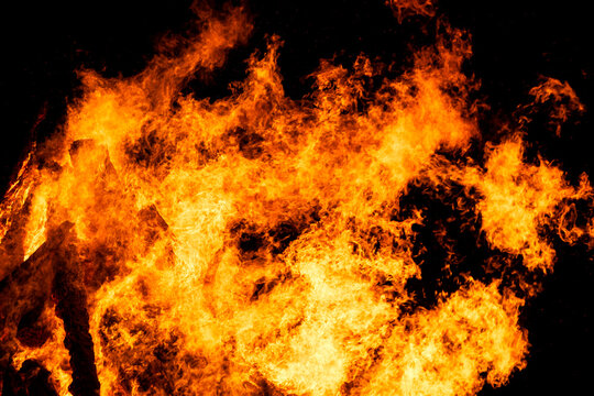 Bonfire flames at solstice celebration at night