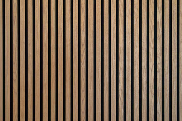Fototapeta premium Sound dampening acoustical panels detail of a wooden wall. Wooden wall texture with wood acoustic panels