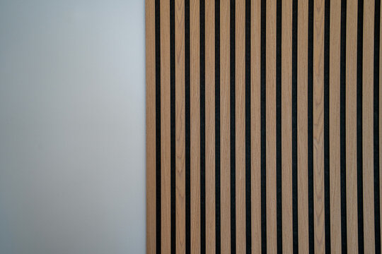 Sound dampening acoustical panels detail of a wooden wall. Wooden wall texture with wood acoustic panels 
