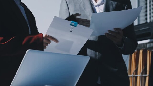 Business woman accountant working in office checking financial accounts and allocating company budgets.