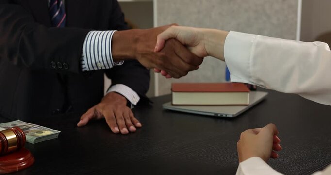 Close up of illegal money exchange between business people during a meeting, representing bribery, corruption, unethical behavior, and violation of law in professional environment.
