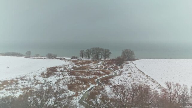 Aerial Drone Over Winter Snowy Landscape at Dawsons Point in Courtice Ontario Canada, Dolly Shot