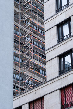 Daylight urban construction building facade windows showing modern architecture and residential development in germany with repeating pattern and texture detail
