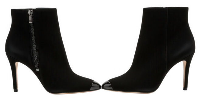 A pair of black high-heeled ankle boots isolated on transparent background