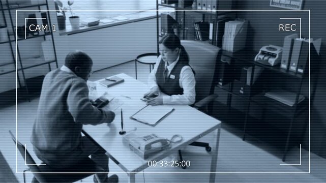 High angle cam view shot of female bank employee helping elderly African American customer in office