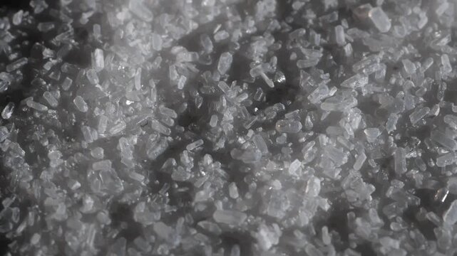 Floating salt. Epsom salt . Shadow. Salt. Slow motion video. . High quality 4k footage