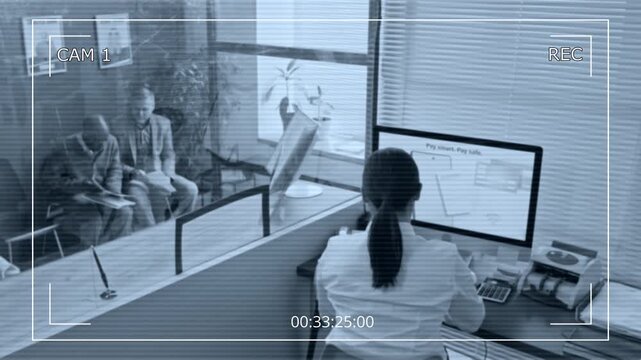 High angle CAM view shot of female bank teller handling documents of elderly African American man at counter with glass divider