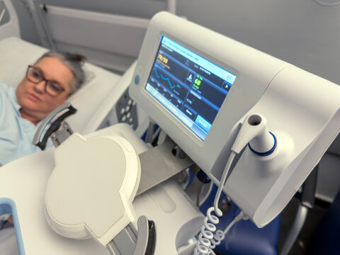 Recovery room after spinal fusion surgery with monitoring equipment and patient comfort in focus, showcasing hope and healing