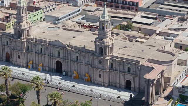 Panning over grand Arequipa Cathedral with sillar stone in Plaza de Armas
