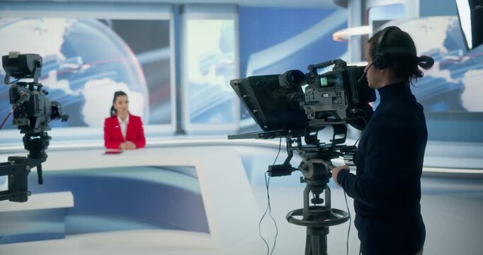 Backstage TV Station Production Control Room Crew Frames a Live Female Anchor, Aligns the Teleprompter, Studio Cameras, Cues Politics, Economy Segments, Coordinates Entertainment. Channel Broadcasting