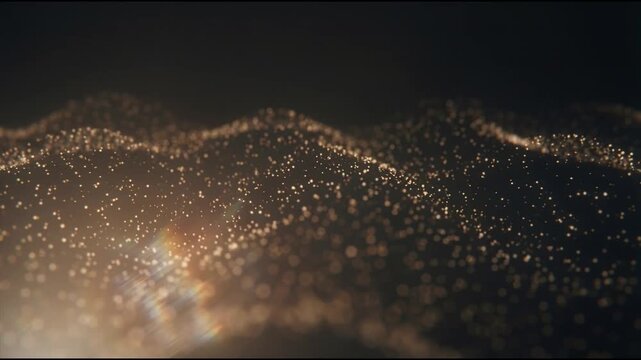 Gold particle background with warm golden dust forming gentle rolling wave ridges flowing smoothly across deep black space creating calm cinematic depth and elegant motion
