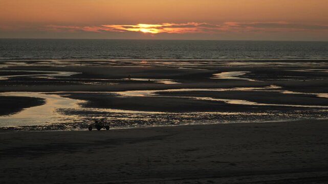 Sand buggy kart ride on the beach during a low tide in France French coast sunset sunrise