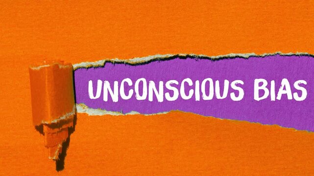 Unconscious bias message writing on ripped torn paper background