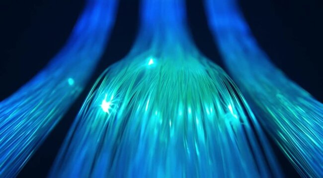 Cinematic close-up of glowing fiber optic cables transmitting blue and bright green light pulses in a dark environment.