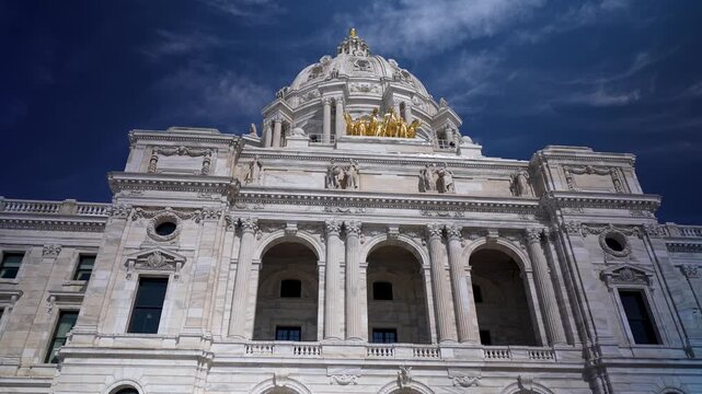 Explore the Minnesota Capitol building in Saint Paul. Enjoy the sunny day and view the architectural details of the building from below.