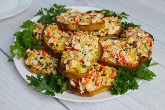 Delicious, quick, mouth-watering hot sandwiches with crab sticks, cheese and green onions.