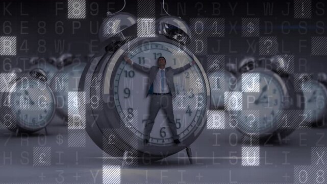 Data overlay starting grid motion, businessman standing inside alarm clock, revealing business data