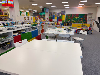 Fototapeta premium Bright lego playroom with tables and displays