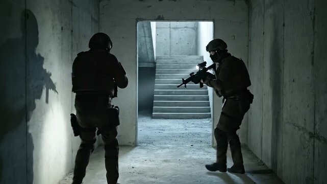 Tactical soldiers clearing a dark building with rifles and flashlights. Military or police special forces operation. Security and defense concept