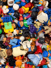 Fototapeta premium Colorful pile of miniature toy figures