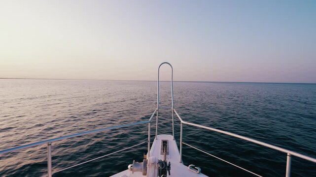 Symmetric Yacht Bow View Facing Infinite Horizon on Still Water at Dusk
