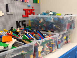 Obraz premium Stacked bins of colorful lego bricks