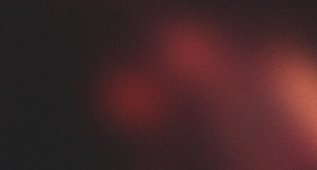 Obraz premium Dark abstract grainy background with subtle red and orange light reflections. a muted, atmospheric backdrop for modern design concepts