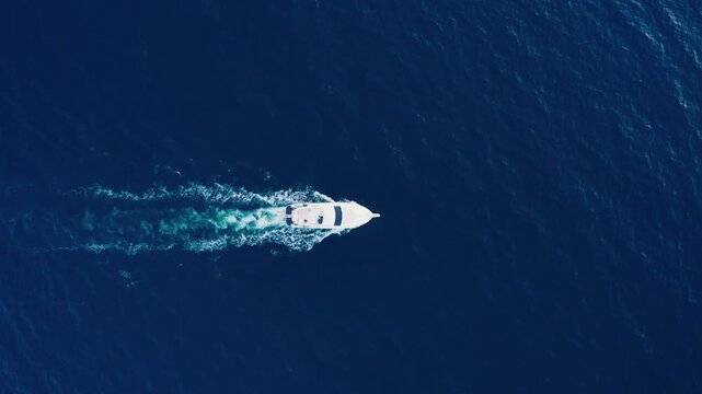 Drone Aerial View of Luxury Boat with Foam Trail on Ocean