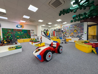 Obraz premium Colorful kids playroom with oversized brick car