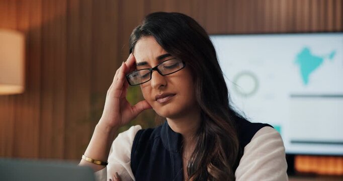 Stress, woman and headache with laptop in office for data mistake, modeling error and workload. Graphs, financial analyst and frustrated with tech for metrics inconsistency, migraine and overwhelmed