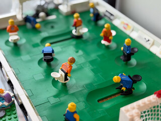 Fototapeta premium Lego minifigure foosball table scene