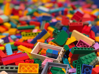 Fototapeta premium Colorful plastic building blocks pile