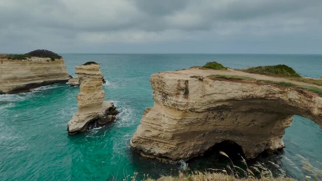 Lover's arch, Puglia before collapsing on Valentine's Day 2026. Faraglioni di Sant&rsquo;Andrea, turquoise ocean