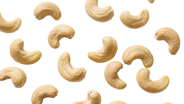 Scattered raw cashew nuts, light beige and healthy, perfectly isolated PNG on transparent background, delicious snack ingredient